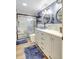 Stylish bathroom featuring a modern vanity, glass bowl sink, and walk-in shower with bench at 1489 18Th St, Sarasota, FL 34234
