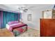Bright bedroom featuring colorful decor, modern ceiling fan, and a comfortable bed at 1489 18Th St, Sarasota, FL 34234