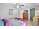 Charming bedroom with decorative ceiling fan, wood furniture, and a cozy atmosphere at 1489 18Th St, Sarasota, FL 34234