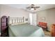 Relaxing bedroom with decorative ceiling fan, comfortable bed, and ample natural light at 1489 18Th St, Sarasota, FL 34234