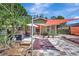 Charming home exterior featuring a brick walkway, cozy seating and beautiful shade canopies at 1489 18Th St, Sarasota, FL 34234