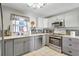 Updated kitchen featuring stylish cabinetry, stainless steel appliances and sleek countertops at 1489 18Th St, Sarasota, FL 34234