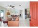 Spacious living room with neutral tile flooring, decorative map wall, and modern furnishings at 1489 18Th St, Sarasota, FL 34234