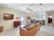 Bright living room with a decorative map wall, modern furniture and access to outdoor space at 1489 18Th St, Sarasota, FL 34234