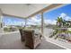 Spacious balcony with patio furniture and scenic views of the surrounding neighborhood and pool at 215 65Th St, Holmes Beach, FL 34217