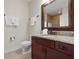 Bathroom with a vanity, granite countertop and a decorative mirror at 215 65Th St, Holmes Beach, FL 34217