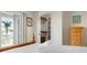 Bedroom with access to balcony and a walk-in closet with built-in shelving at 215 65Th St, Holmes Beach, FL 34217