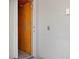 Interior home elevator with a wooden door and simple control panel at 215 65Th St, Holmes Beach, FL 34217