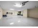 Spacious garage with ample lighting, epoxy flooring, and extra storage space, perfect for vehicle and tool storage at 215 65Th St, Holmes Beach, FL 34217