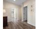 Inviting hallway with neutral paint, wood floors, and views into adjacent rooms at 215 65Th St, Holmes Beach, FL 34217