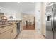 Bright kitchen with stainless steel appliances, flowing into the living area, perfect for entertaining and gatherings at 215 65Th St, Holmes Beach, FL 34217