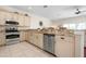 Well-appointed kitchen featuring stainless steel appliances, granite countertops, and bright cabinetry at 215 65Th St, Holmes Beach, FL 34217
