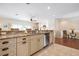 Open kitchen design with granite countertops, stainless steel appliances, and a seamless transition to the living area at 215 65Th St, Holmes Beach, FL 34217