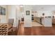 A view from the dining area looking to the eat-in kitchen featuring stainless appliances and granite counters at 215 65Th St, Holmes Beach, FL 34217