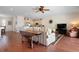 Open concept living room and eat-in kitchen with hardwood floors and neutral-toned decor at 215 65Th St, Holmes Beach, FL 34217