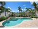 Inviting pool with an attached spa area, surrounded by lush landscaping, perfect for outdoor relaxation at 215 65Th St, Holmes Beach, FL 34217