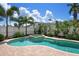 Beautiful backyard pool and spa with tropical landscaping providing privacy and a relaxing outdoor oasis at 215 65Th St, Holmes Beach, FL 34217