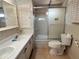 Functional bathroom with a double sink vanity and a glass-enclosed shower at 237 Blackburn Blvd, North Port, FL 34287