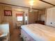 Well-lit bedroom with vintage wallpaper, furniture, and large closet at 237 Blackburn Blvd, North Port, FL 34287