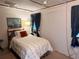 Comfortable bedroom with a cozy bed and nautical wall art at 237 Blackburn Blvd, North Port, FL 34287
