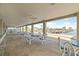 Covered patio with dining tables that overlooks the community marina at 237 Blackburn Blvd, North Port, FL 34287