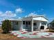 Charming single-story home with a covered entrance and cozy front yard, perfect for relaxed living at 237 Blackburn Blvd, North Port, FL 34287