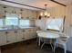 Bright kitchen featuring neutral cabinets, updated counters, and all essential appliances at 237 Blackburn Blvd, North Port, FL 34287