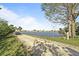 Picturesque lake view with a golf cart trail that offers easy access to the water at 237 Blackburn Blvd, North Port, FL 34287