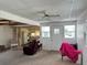 Open living room showcasing ample natural light and seamless transition to the kitchen area at 237 Blackburn Blvd, North Port, FL 34287