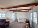 Cozy living area with exposed beams, a ceiling fan, and comfortable seating arrangement at 237 Blackburn Blvd, North Port, FL 34287