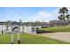 Community marina with boat slips, lush landscaping, and signage promoting caution for manatees at 237 Blackburn Blvd, North Port, FL 34287