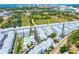 Aerial view of the townhome community with its blue and white buildings; the location is near downtown and the bay at 2408 Ezzell Ct, Sarasota, FL 34237