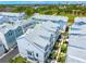 Overhead view of a gray roofed townhome with nearby landscaping and a glimpse of the surrounding community at 2408 Ezzell Ct, Sarasota, FL 34237
