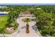 Overhead view of Payne Park featuring a landscaped roundabout, playground, and lush greenery at 2408 Ezzell Ct, Sarasota, FL 34237
