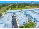 Aerial view of the townhome community featuring a park and city skyline, showcasing a prime location at 2408 Ezzell Ct, Sarasota, FL 34237