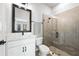 Stylish bathroom with glass shower, vanity with dark fixtures, and modern design at 2408 Ezzell Ct, Sarasota, FL 34237