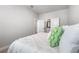 Bedroom with ensuite bath access and white comforter at 2408 Ezzell Ct, Sarasota, FL 34237
