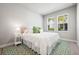 Cozy bedroom with decorative rug, side table, and bright windows at 2408 Ezzell Ct, Sarasota, FL 34237