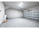 Spacious garage with speckled epoxy flooring and an automatic door, offering ample parking and storage at 2408 Ezzell Ct, Sarasota, FL 34237