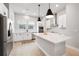 Modern kitchen with white cabinets, stainless steel appliances, and a center island at 2408 Ezzell Ct, Sarasota, FL 34237