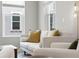 Bright living room featuring modern furniture and large windows at 2408 Ezzell Ct, Sarasota, FL 34237