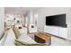 Spacious living area with hardwood floors, open to a modern kitchen at 2408 Ezzell Ct, Sarasota, FL 34237