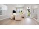 Cozy living room with stylish furniture, ample natural light, and access to an outdoor balcony at 2408 Ezzell Ct, Sarasota, FL 34237