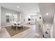 Open-concept living and dining area with neutral tones and natural light at 2408 Ezzell Ct, Sarasota, FL 34237