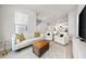 Open concept living room with hardwood floors and modern decor at 2408 Ezzell Ct, Sarasota, FL 34237