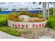 Welcoming Payne Park entrance sign with vibrant landscaping, perfect for a community gathering spot at 2408 Ezzell Ct, Sarasota, FL 34237