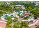 Aerial view of the playground featuring climbing structures, swings, and slides for to enjoy at 2408 Ezzell Ct, Sarasota, FL 34237