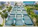 Aerial view of community tennis courts, well-maintained and offering a great amenity for active residents at 2408 Ezzell Ct, Sarasota, FL 34237