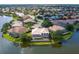 Aerial view showcasing the home's backyard facing the lake at 2496 Farms Ct, Sarasota, FL 34240
