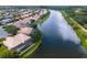 Aerial view of the backyard, pool, and lake at 2496 Farms Ct, Sarasota, FL 34240